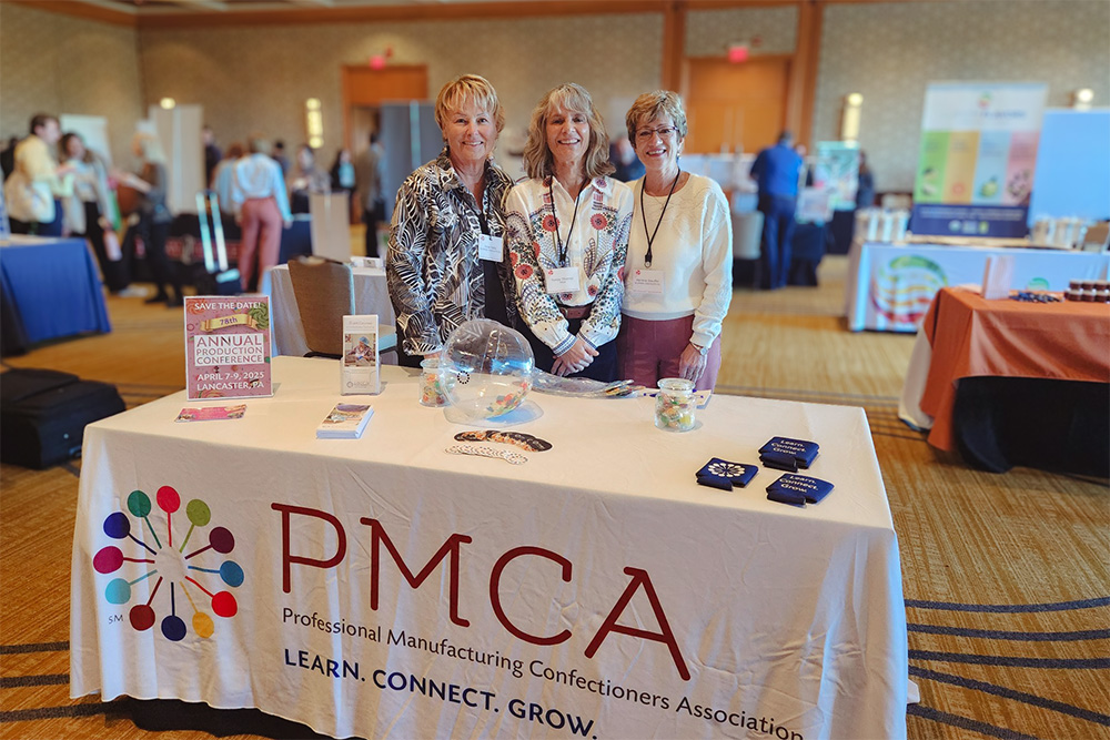 Rose Potts, Yvette Thomas and Marlene Stauffer at a PMCA table